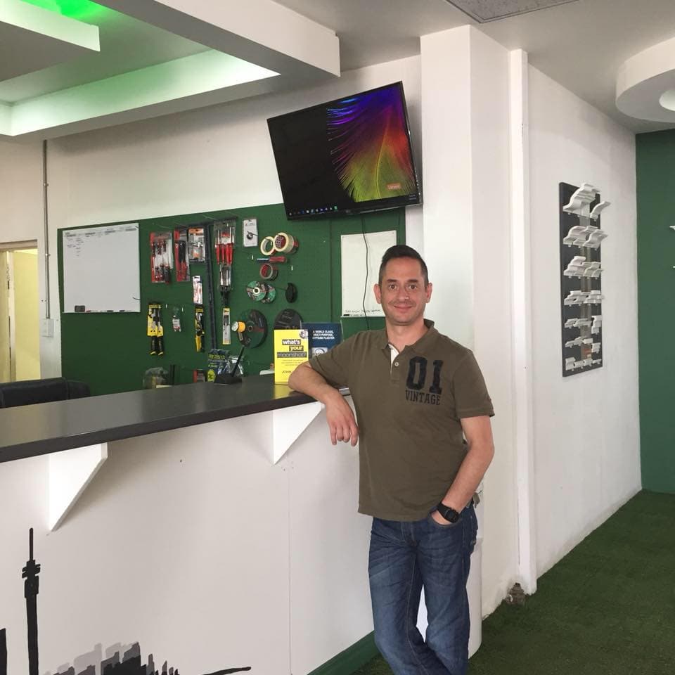 The Fundis team member standing at the trade counter.