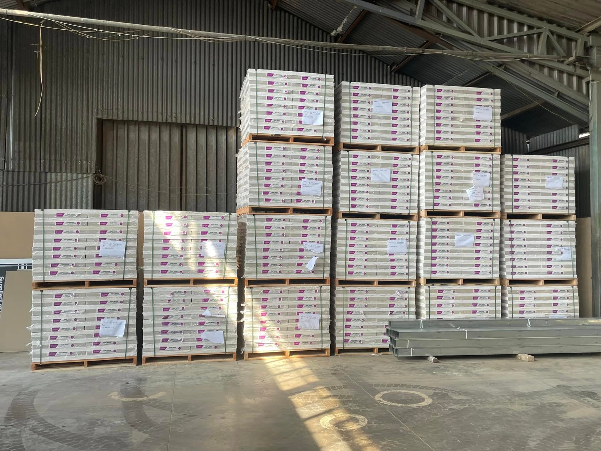 Packed warehouse aisles and stock ready for dispatch or collection.